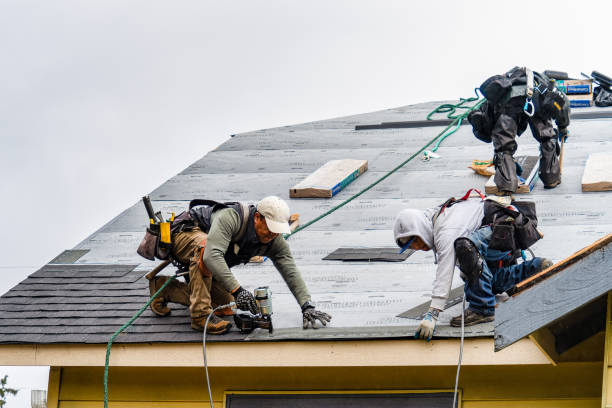 Professional Gutter Installation technician working in North Springfield, VT